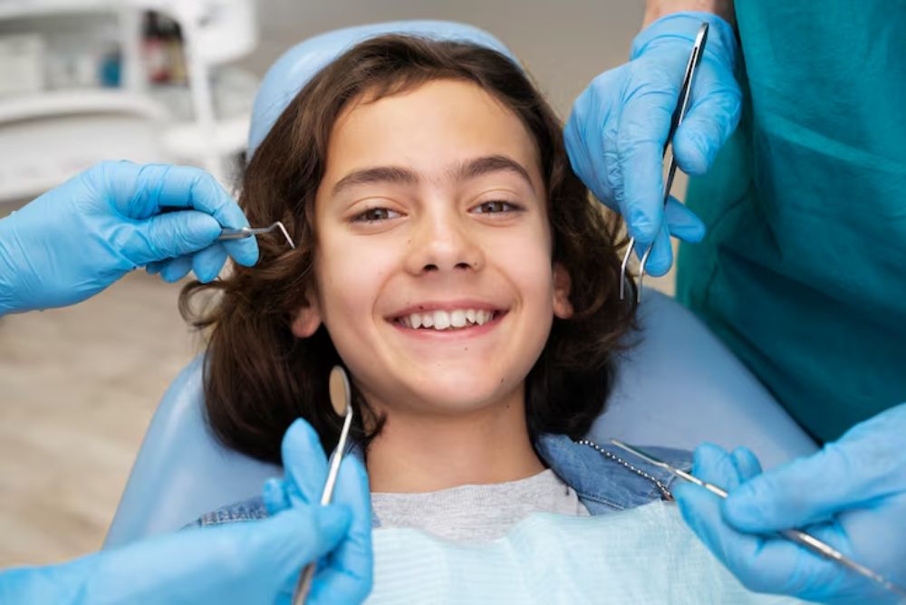 pediatric dentist examining a child for a dental crown
