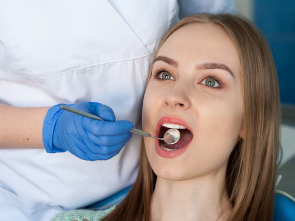 dentist examining a patient's tooth during a root canal evaluation