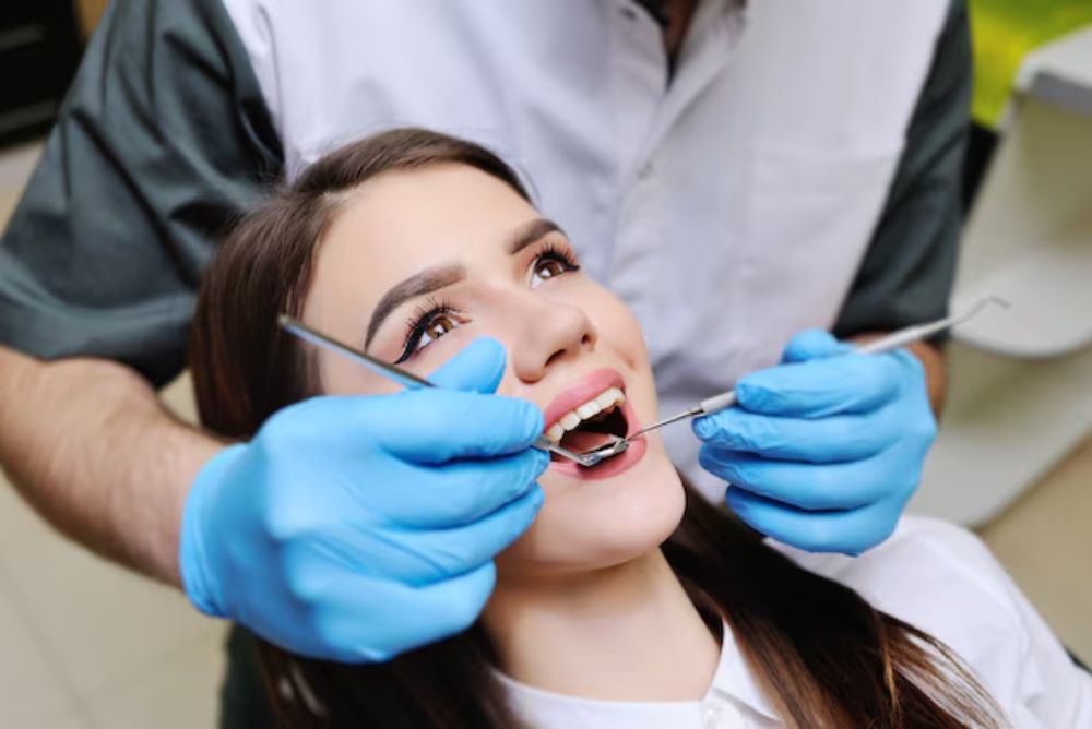 woman undergoing dental treatment for dentures