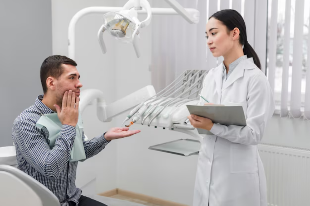 dentist explaining aftercare instructions following wisdom tooth removal